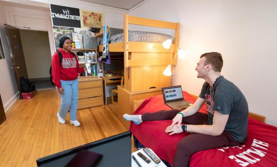 Photo of two 51 students in an on-campus residence hall