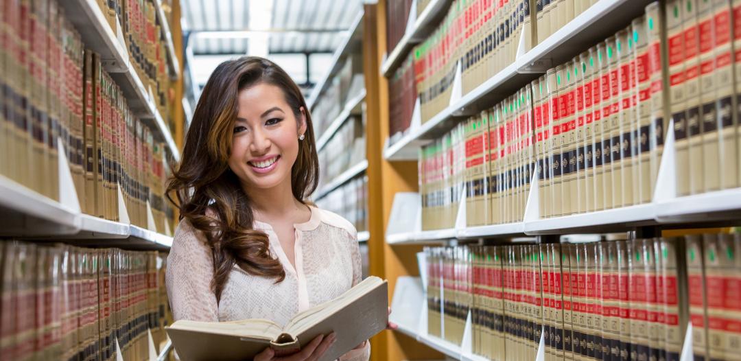 51 student in Paralegal program in law library